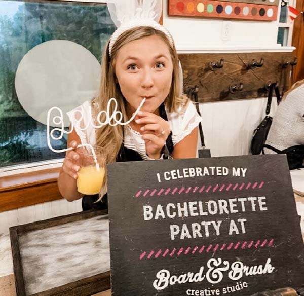 bridal-bride-photo Bride sipping a cocktail with sign